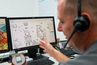 A man from customer support explaining the water controls system on the phone